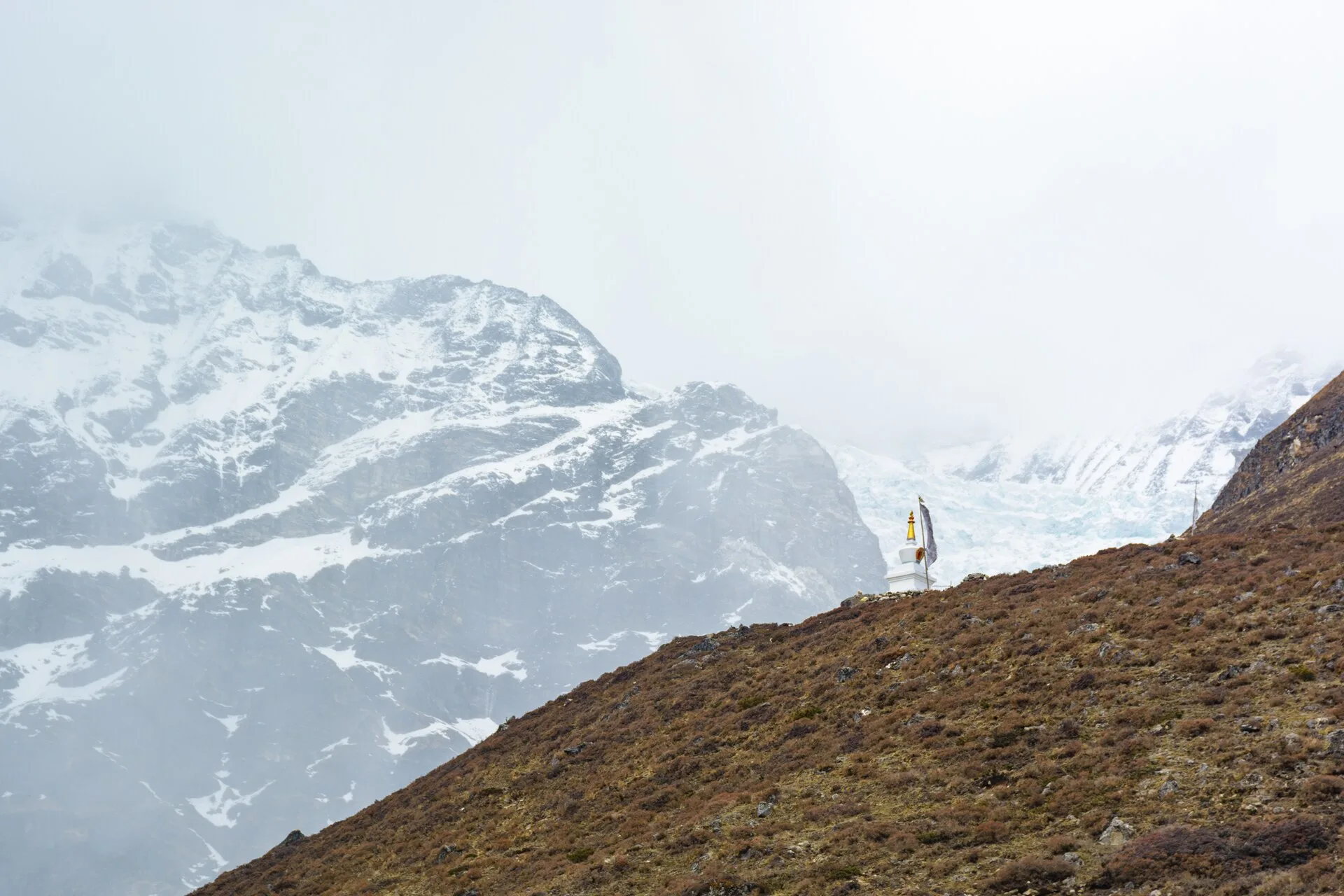 A chorten and mountain landscape in the Langtang region